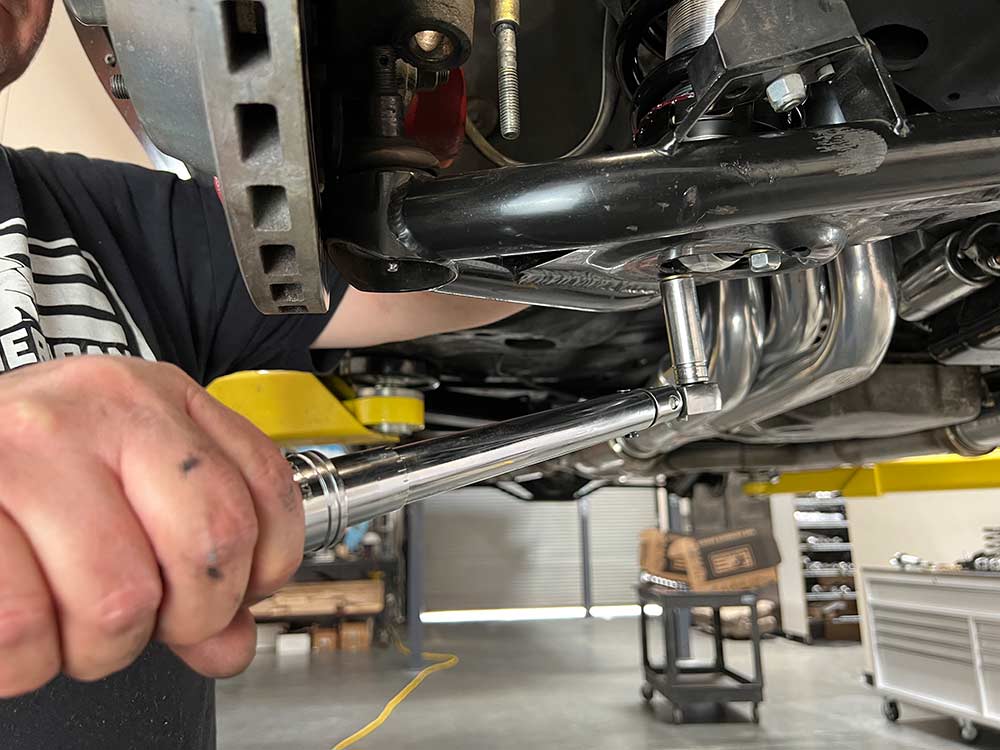 reconnect the ball joint and final torque the coilover mounting bolts on the bottom side of the lower A-arm to 35 ft. lbs